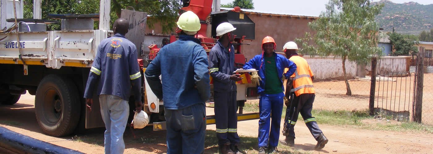 Electrical contractor working on-site with power tools